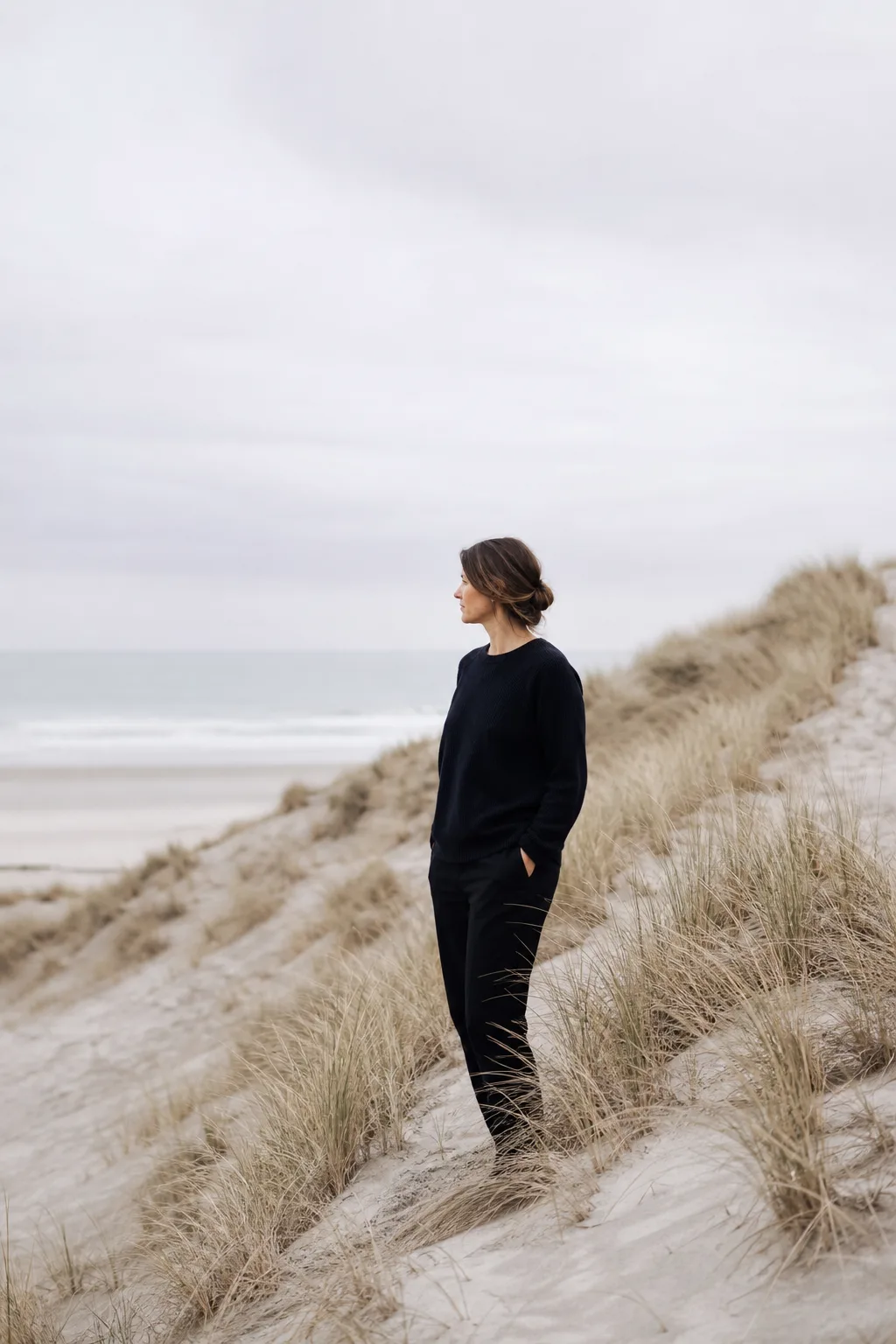 A quiet coastal portrait session using soft northern daylight.